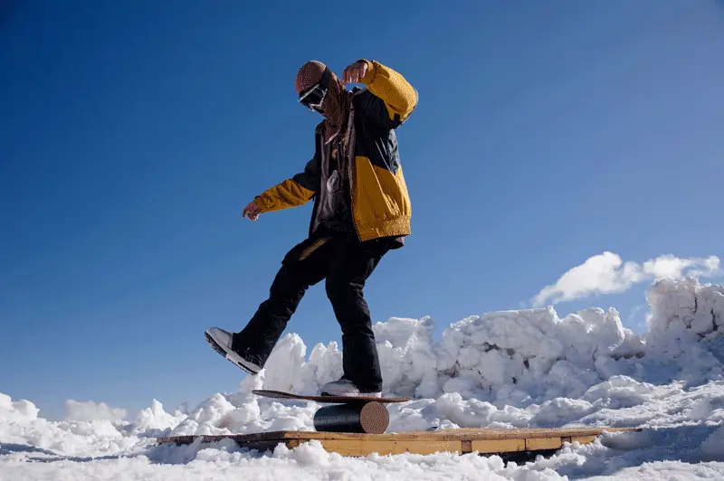 How do I keep my balance while snowboarding